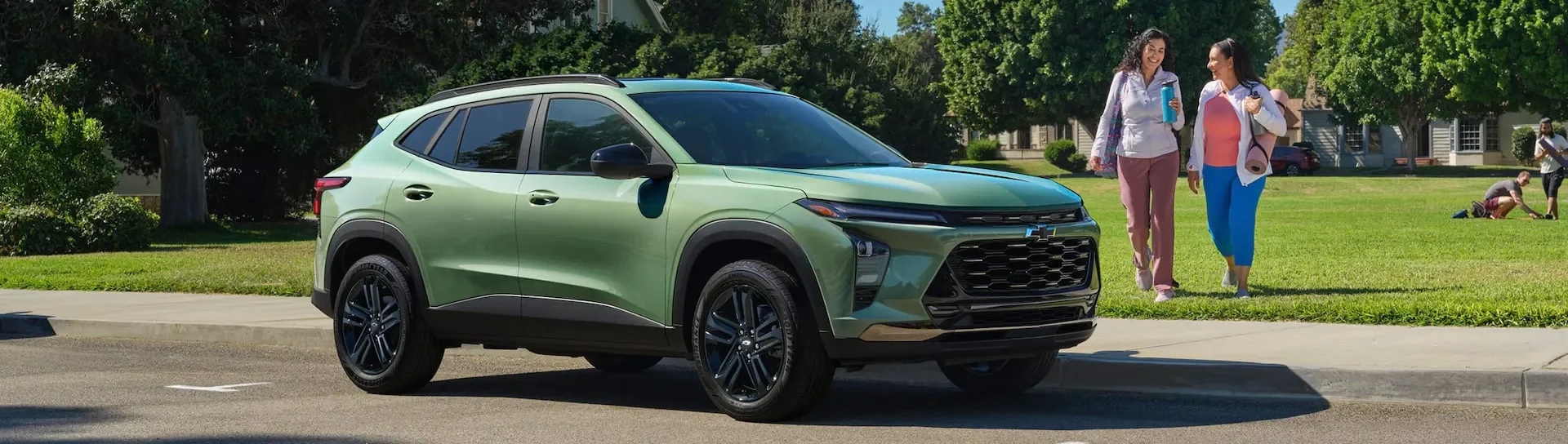 2026 Chevrolet Trax parked outdoors with people nearby during the day